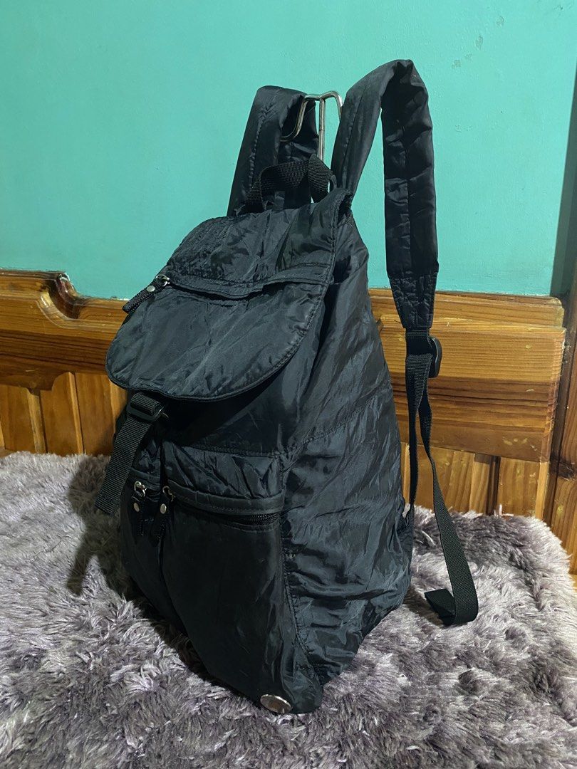 Adidas Black Nylon Drawstring Backpack (Category: Backpacks) located in La Trinidad. Submitted by kinleyky (Listing ID 1446661413, Image 3). Description: - Classic black Adidas backpack - Secure drawstring closure under a flap - Multiple convenient zip pockets on the front - Comfortable padded shoulder straps - Ideal for everyday use or travel - Iconic Adidas logo prominently displayed on the front.
