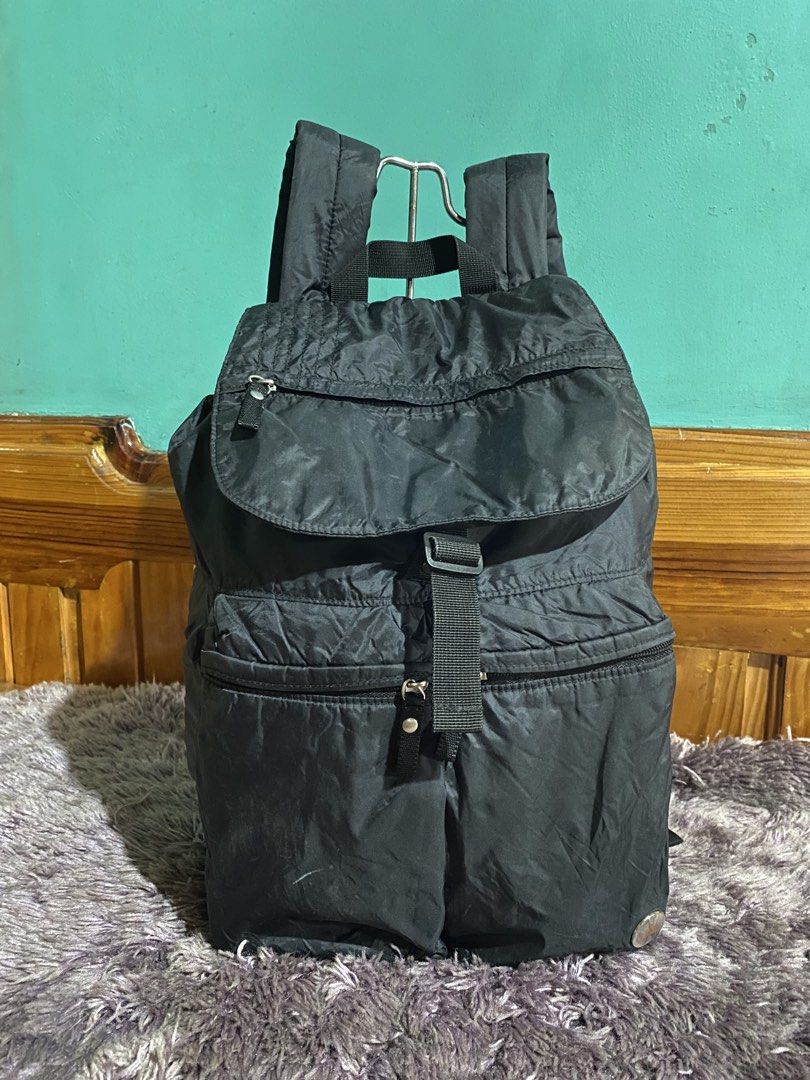 Adidas Black Nylon Drawstring Backpack (Category: Backpacks) located in La Trinidad. Submitted by kinleyky (Listing ID 1446661413, Image 1). Description: - Classic black Adidas backpack - Secure drawstring closure under a flap - Multiple convenient zip pockets on the front - Comfortable padded shoulder straps - Ideal for everyday use or travel - Iconic Adidas logo prominently displayed on the front.