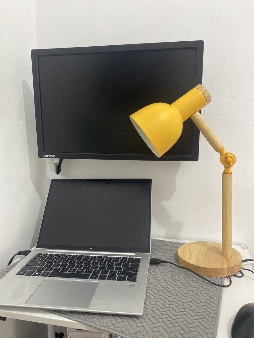 Adjustable Desk Lamp with Wooden Base - Yellow (Category: Lighting) located in Taguig. Submitted by ceej0915 (Listing ID 1446626276, Image 2). Description: - Bright yellow desk lamp - Sturdy wooden base - Adjustable arm for perfect lighting - Excellent working condition - Includes power cord - Perfect for study desks or bedside tables.