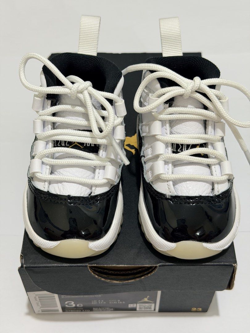 Air Jordan 11 Retro Toddler (Category: Babies & Kids Fashion) located in Pasig City. Submitted by myprelovedcorner (Listing ID 1446678636, Image 3). Description: - Air Jordan 11 Retro Toddler Shoes - Classic black and white colorway - Patent leather toe box - Lace-up front closure - Heel pull tab for easy on/off - Translucent very clean sole; hindi na apak sa floor ever - Size: 3c | 9cm - Used once during photoshoot lang. Never na- i lakad sa flo
