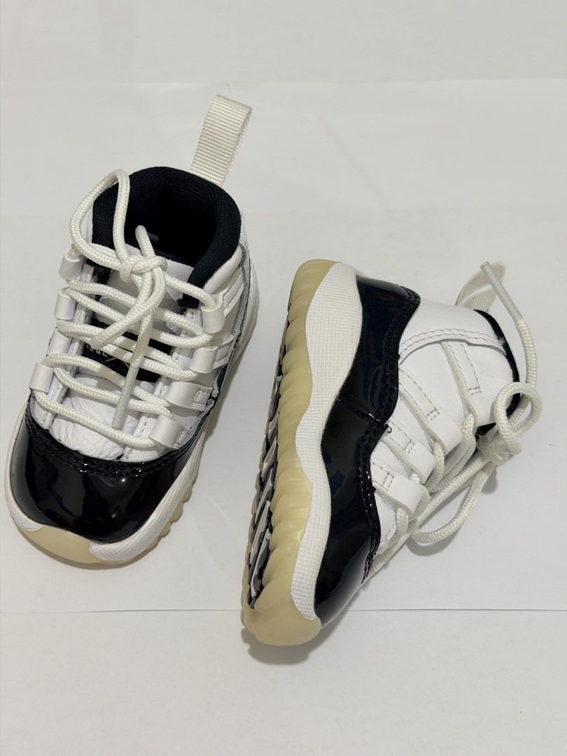 Air Jordan 11 Retro Toddler (Category: Babies & Kids Fashion) located in Pasig City. Submitted by myprelovedcorner (Listing ID 1446678636, Image 1). Description: - Air Jordan 11 Retro Toddler Shoes - Classic black and white colorway - Patent leather toe box - Lace-up front closure - Heel pull tab for easy on/off - Translucent very clean sole; hindi na apak sa floor ever - Size: 3c | 9cm - Used once during photoshoot lang. Never na- i lakad sa flo