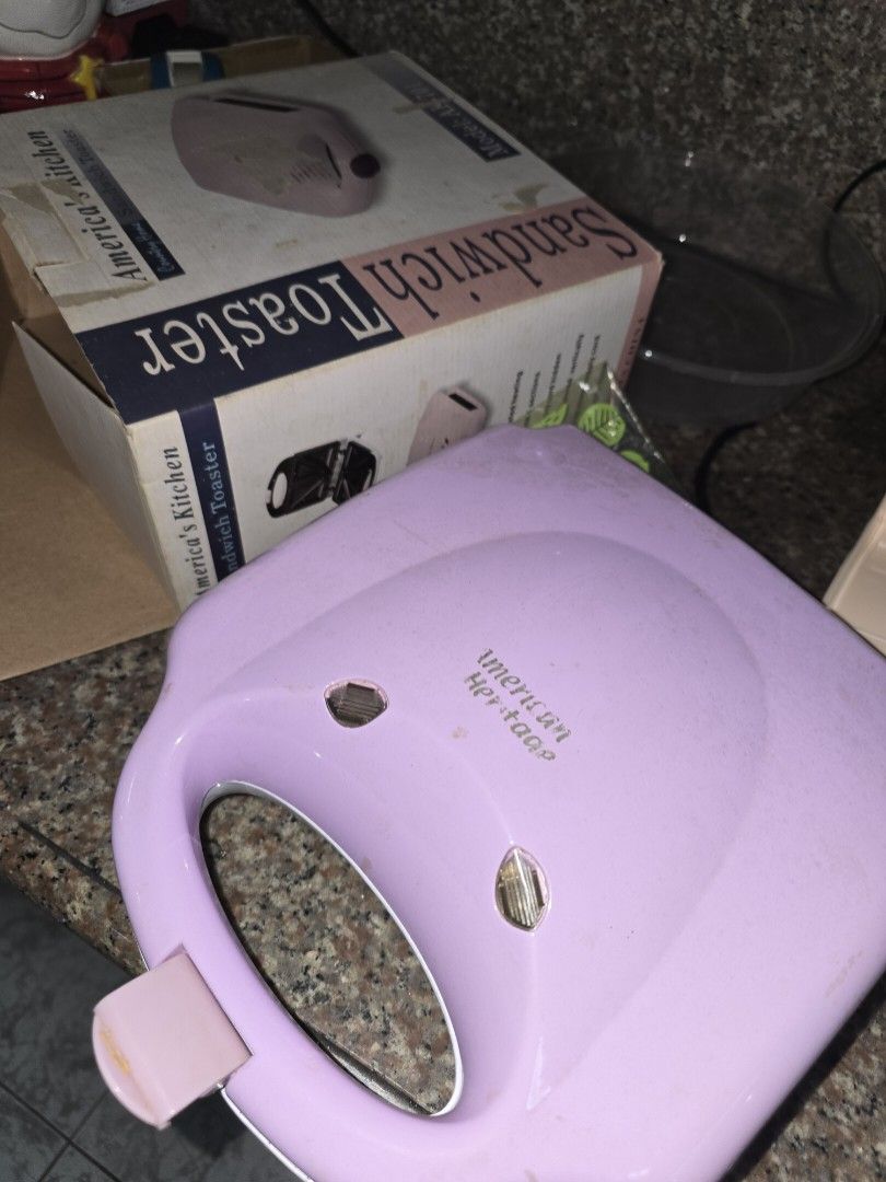 American Heritage Sandwich Toaster Maker (Category: Ovens & Toasters) located in Caloocan City. Submitted by mluck (Listing ID 1446638867, Image 3). Description: - American Heritage waffle maker - Makes 4 mini sandwiches at a time - Indicator lights are functional - Plates show some residue from use - Comes with original packaging - Ideal for preparing quick and easy snacks.