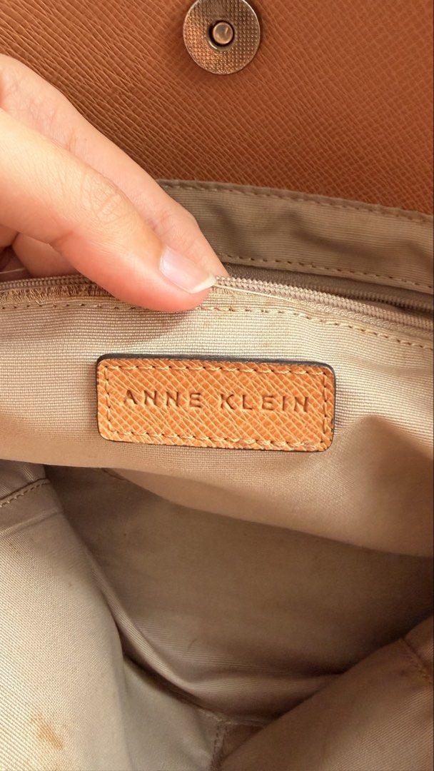 Anne Klein Tan Satchel Handbag with Shoulder Strap (Category: Shoulder Bags) located in Manila. Submitted by shopce (Listing ID 1446548065, Image 3). Description: Anne klein satchel bag (preloved) Anne Klein tan textured satchel. Top handles, adjustable strap. Interior zip and slip pockets. Minor interior marks. Gold hardware. Perfect everyday bag. - in pristine condition - used thrice only - bought it in marketplace also - flaws meron rust sa me