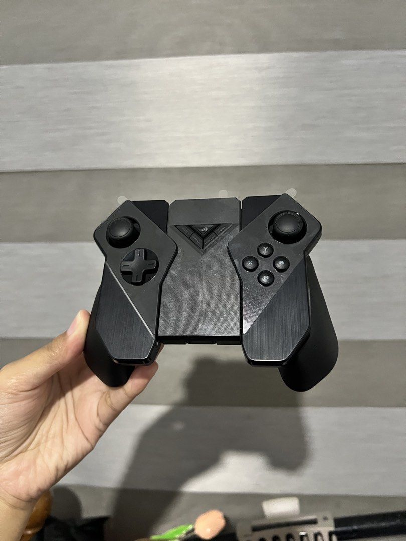 ASUS ROG Kunai Gamepad Controller (Category: Controllers) located in Manila. Submitted by sapphic_nyx0715 (Listing ID 1446623791, Image 2). Description: - ROG Kunai Gamepad - Perfect for mobile gaming - Includes original box - All original accessories included - Warranty card and user guide present - Good as new, used only for testing - Location: North Caloocan - SF c/o buyer.
