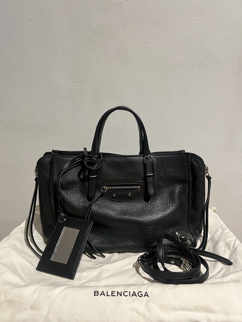 BALENCIAGA MINI PAPIER BAG (Category: Luxury Bags & Wallets) located in Quezon City. Submitted by __n1kki (Listing ID 1446718055, Image 1). Description: - Classic Balenciaga black leather bag - Features top handles - Detachable shoulder strap included - Iconic mirror charm - Spacious interior - Silver-tone hardware - Ideal for everyday use - Comes with original dust bag Meetup available along QC area.