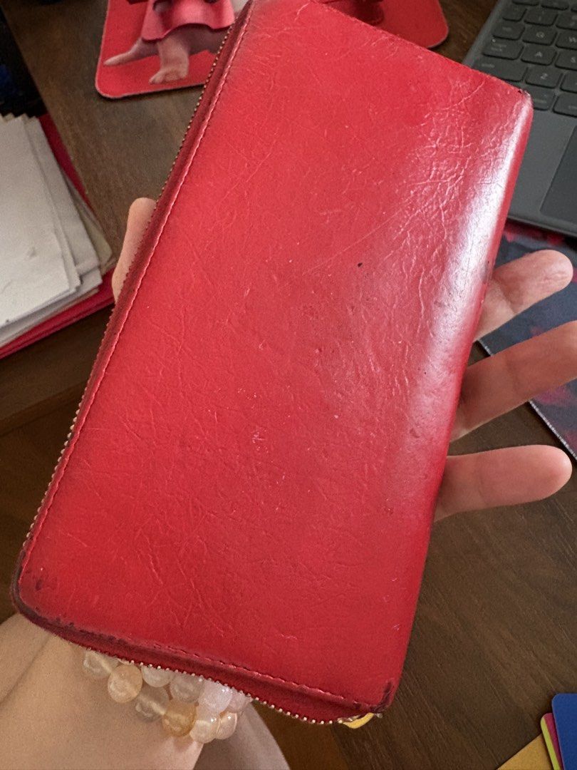 Balenciaga Red Leather Zip Around Wallet (Category: Luxury Bags & Wallets) located in Las Pinas. Submitted by redbutterfly27 (Listing ID 1446582547, Image 3). Description: - Authentic Red Leather Balenciaga Wallet - Zip-around closure - Gold hardware with signature stud and buckle details - Multiple interior card slots - Interior zippered coin pocket - Plenty of life left!.