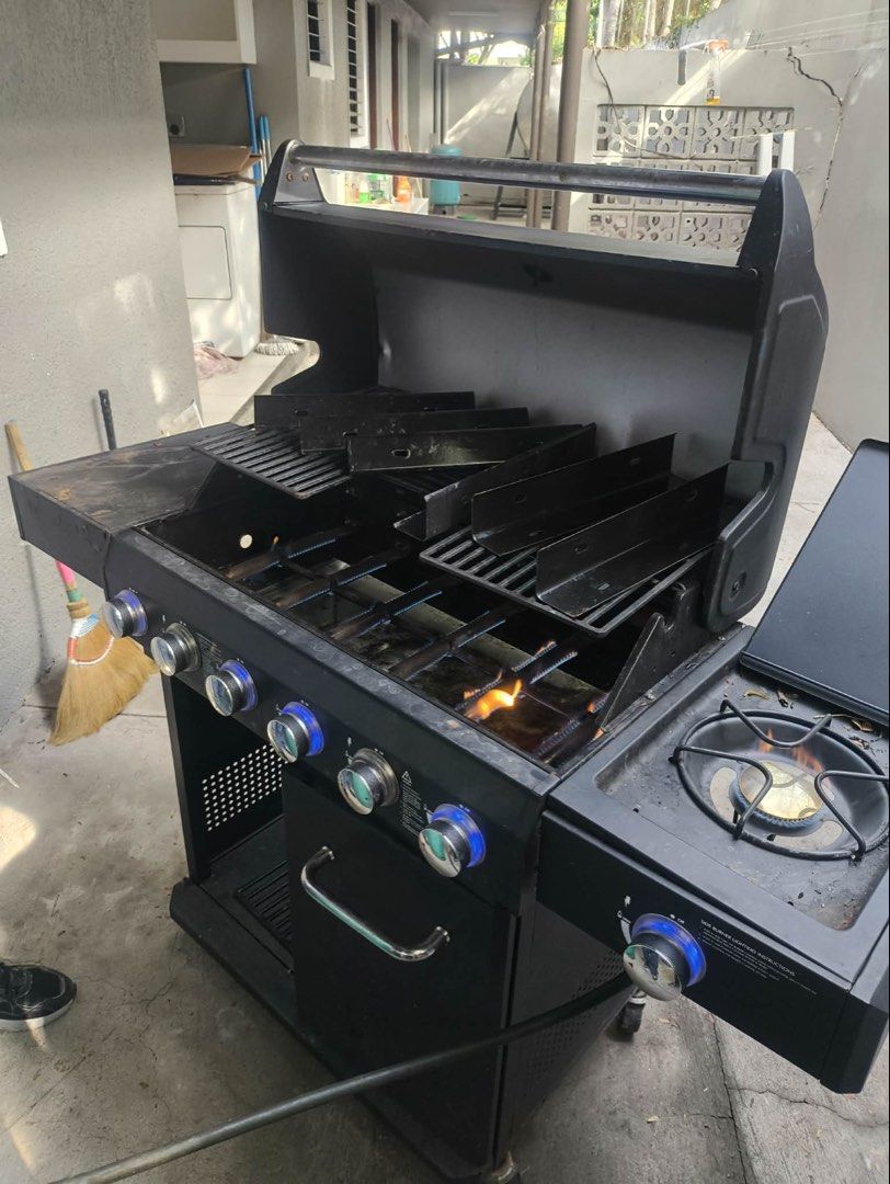 BBQ Gas Grill with Side Burner (Category: BBQ, Grills & Hotpots) located in Makati City. Submitted by arlene.gc (Listing ID 1446640681, Image 2). Description: - Black 4-burner gas grill - Includes a convenient side burner for extra cooking space - Grills are in place and ready to use - slightly used - Equipped with wheels for easy portability - Perfect for your next barbecue gathering - FREE Gas Tank.
