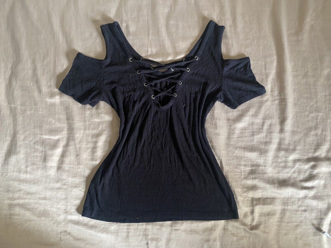 Bebe Rhinestone Cold Shoulder Top with Black Handbag (Category: Shirts) located in Manila. Submitted by kellemirah (Listing ID 1446688205, Image 2). Description: - Black Bebe - Trendy cold shoulder design. - Adjustable lace-up detail at the neckline. - Comfortable short sleeves..