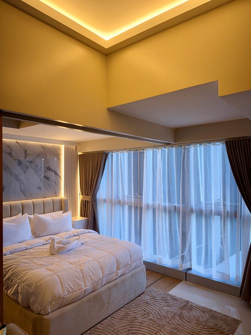 BGC Staycation Airbnb booking (Category: Apartments & Condos) located in Taguig. Submitted by modestasuites (Listing ID 1446637948, Image 1). Description: Stay in the heart of Uptown BGC at this newly furnished 1 bedroom unit with a 55” Smart TV, 300 Mbps WiFi, and self check-in. The space is gaming-inspired, complete with PlayStation 5 Pro 30th Anniversary Limited Edition w/ PS Plus Extra subscription for hundred of game choices! airbnb.com/h/bg