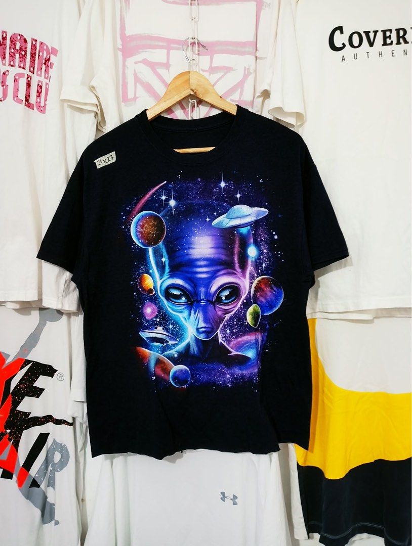 Black Alien Space Graphic Crop T-Shirt (Category: Tshirts & Polo Shirts ) located in Siniloan. Submitted by project_thrift (Listing ID 1446644595, Image 1). Description: - Cool Blue t-shirt - Vibrant alien and space graphic - Features planets, stars, and a UFO - Detailed and colorful design - Ideal for space and alien enthusiasts - Comfortable, casual tee -Crop tee.