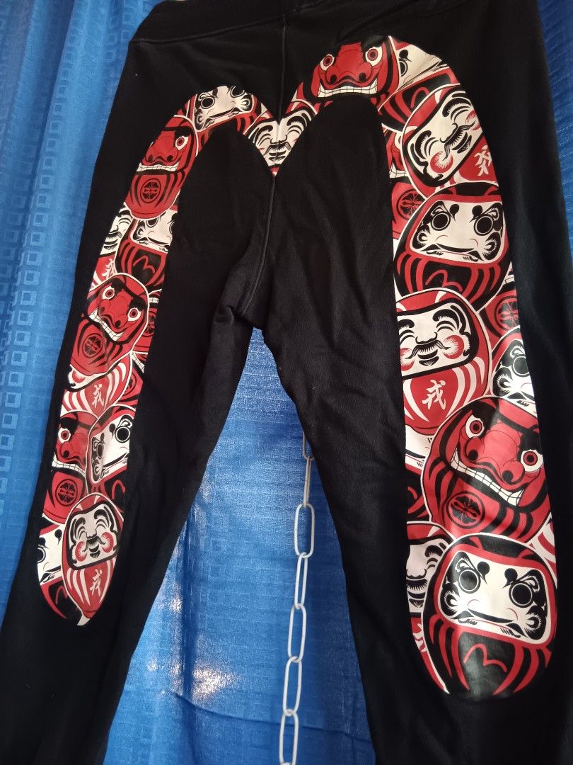 Black Jogger Pants with Daruma Doll Print (Category: Joggers) located in Bulacan. Submitted by theresamol61611 (Listing ID 1446656189, Image 2). Description: - Stylish black jogger pants with an all-over Daruma doll print on the legs. - Features a comfortable elastic waistband and elastic cuffs. - Ideal for casual outings or relaxing at home. - Offers a comfortable and relaxed fit..