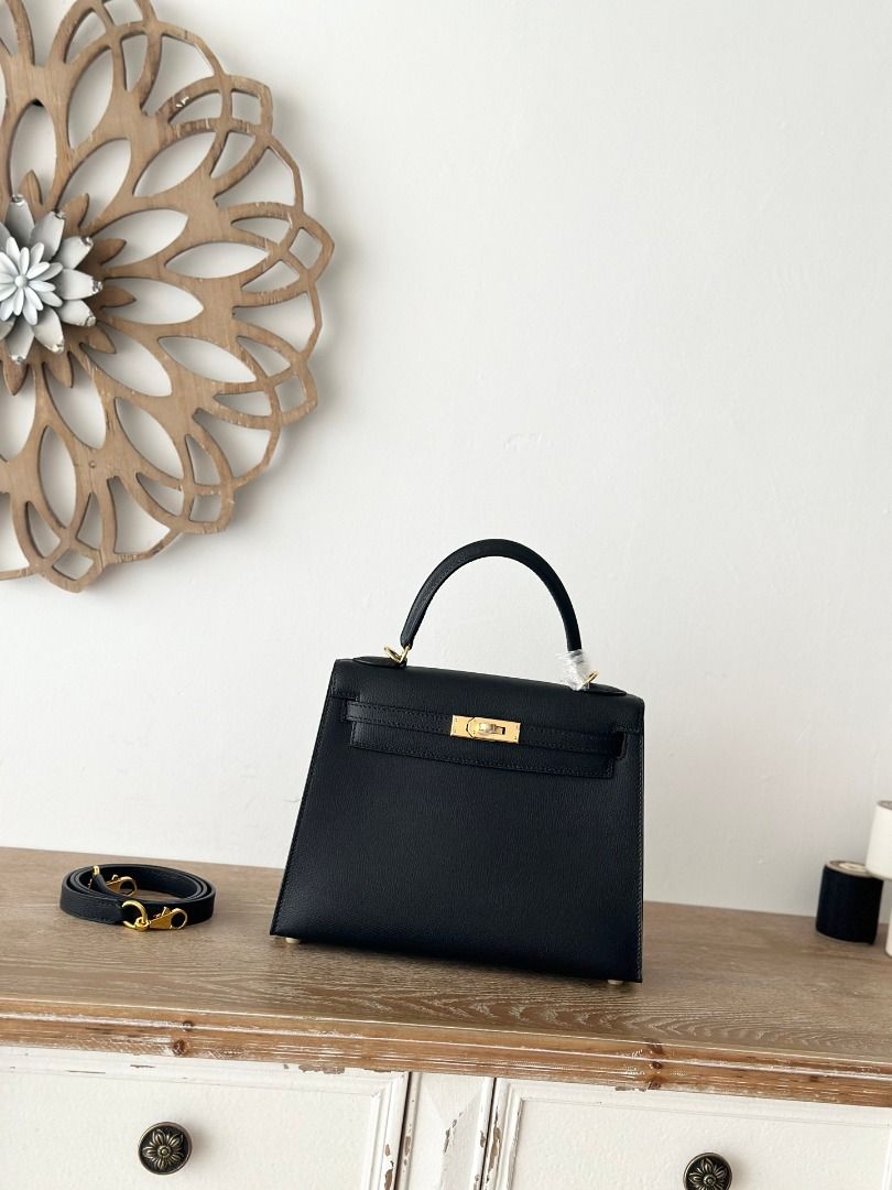 Black Leather Handbag with Gold Hardware (Category: Luxury Bags & Wallets) located in San Juan City. Submitted by mulakibebb18615 (Listing ID 1446624447, Image 1). Description: - Classic black leather handbag - Top handle and detachable shoulder strap - Gold-tone hardware (clasp and feet) - Structured design - Spacious interior - Versatile for daily use or special occasions.