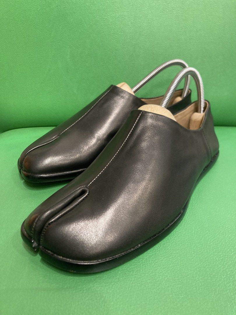 Black Leather Tabi Split Toe Shoes (Category: Flats & Sandals) located in Quezon City. Submitted by janisu0303 (Listing ID 1446711997, Image 2). Description: - Black leather tabi shoes - Split toe design - Size 37 - 2800 pesos - as new condition - Includes shoe trees - Adds a unique touch to any outfit - Easy slip-on style Fairview area meetups Or shipping Tabi Margiela.