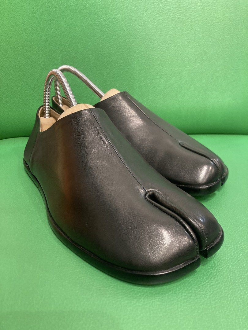 Black Leather Tabi Split Toe Shoes (Category: Flats & Sandals) located in Quezon City. Submitted by janisu0303 (Listing ID 1446711997, Image 1). Description: - Black leather tabi shoes - Split toe design - Size 37 - 2800 pesos - as new condition - Includes shoe trees - Adds a unique touch to any outfit - Easy slip-on style Fairview area meetups Or shipping Tabi Margiela.