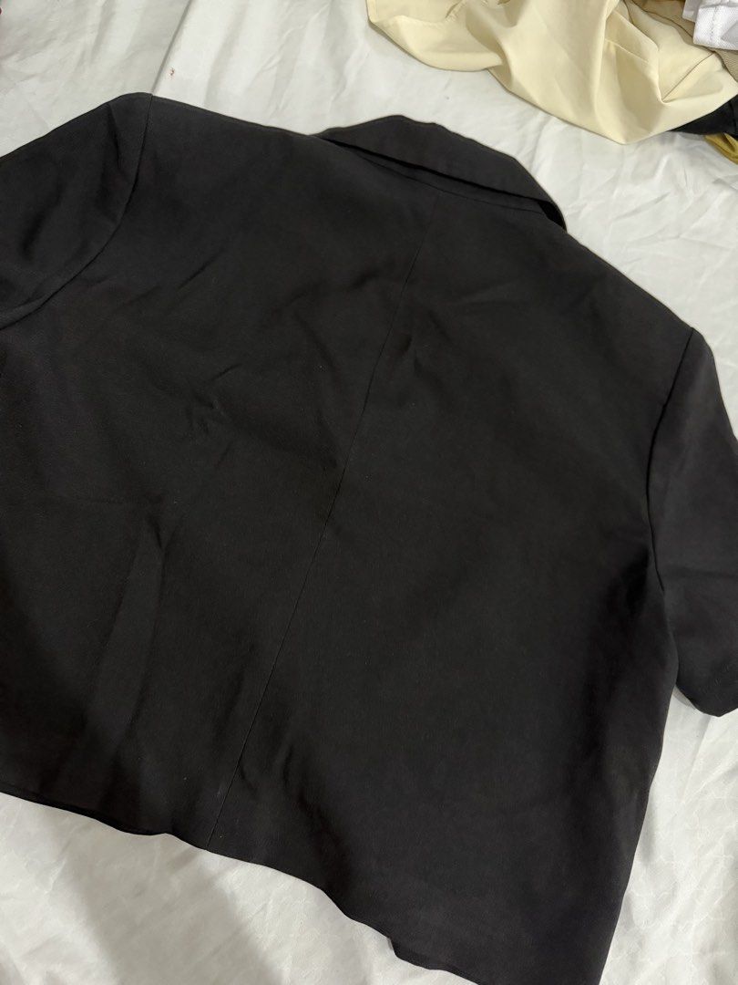 Black Short Sleeve Cropped Blazer (Category: Coats, Jackets and Outerwear) located in Quezon City. Submitted by jdmc16 (Listing ID 1446609122, Image 2). Description: - Black cropped blazer - Short sleeves - Two-button front closure - Two flap pockets - Estimated size: M or L - Measurements: Approx. 20" chest, 19" length - Note: Small mark on sleeve.