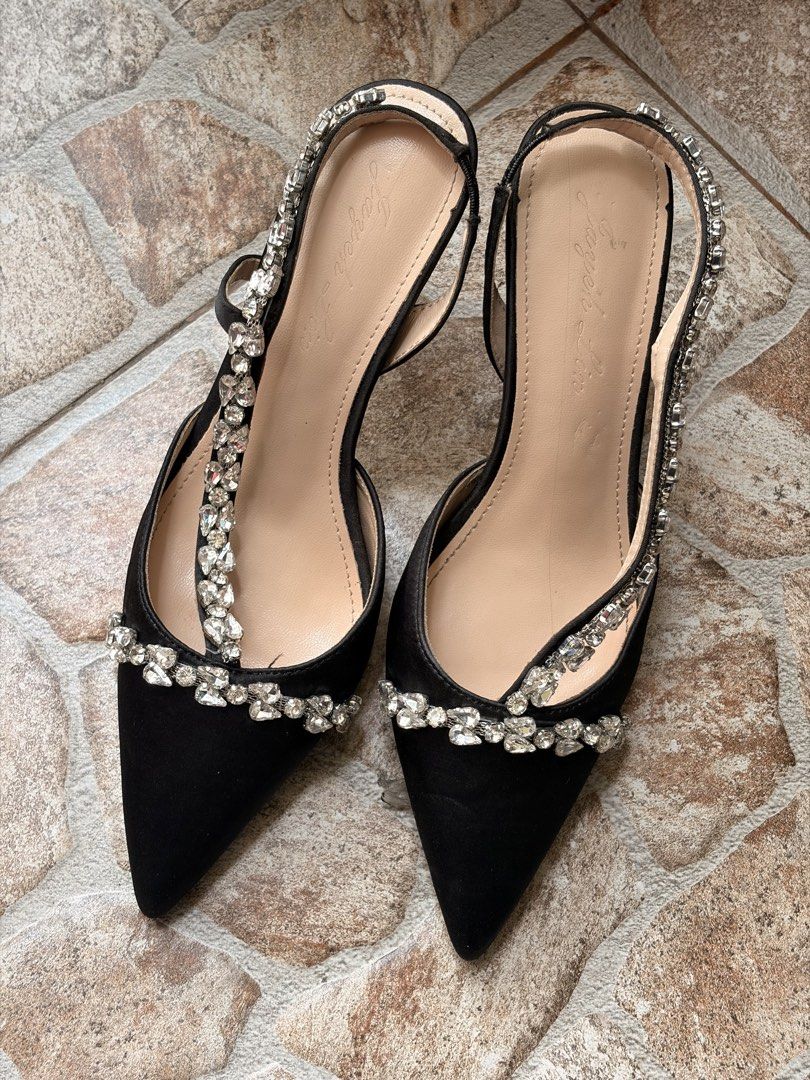 Black Slingback Heels with Rhinestone Embellishments (Category: Heels) located in Manila. Submitted by bratrcm (Listing ID 1446656197, Image 1). Description: - Elegant black slingback heels - Chic pointed toe design - Dazzling rhinestone embellishments on straps and front - Comfortable moderate heel height - Soles show minor wear, with protective plastic still attached in some areas - Ideal for parties, events, or elevating any outfit EU 38 - bes