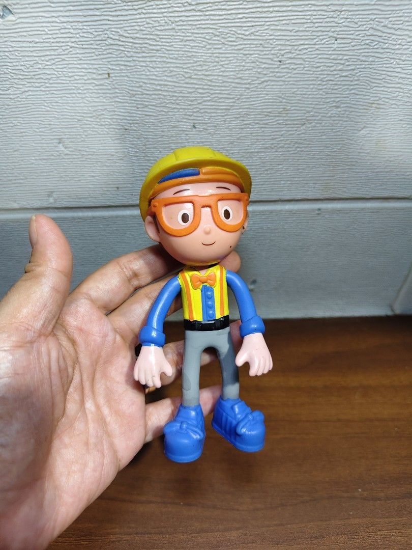 Blippi Bendable Action Figure Toy (Category: Kids Toys) located in Las Pinas. Submitted by mommy_14 (Listing ID 1446570640, Image 1). Description: - Blippi action figure ready for adventures. - Iconic Blippi outfit: yellow hard hat, orange glasses, blue shirt, yellow vest, grey pants, and blue boots. - Ideal for any Blippi fan. - Great for playtime..