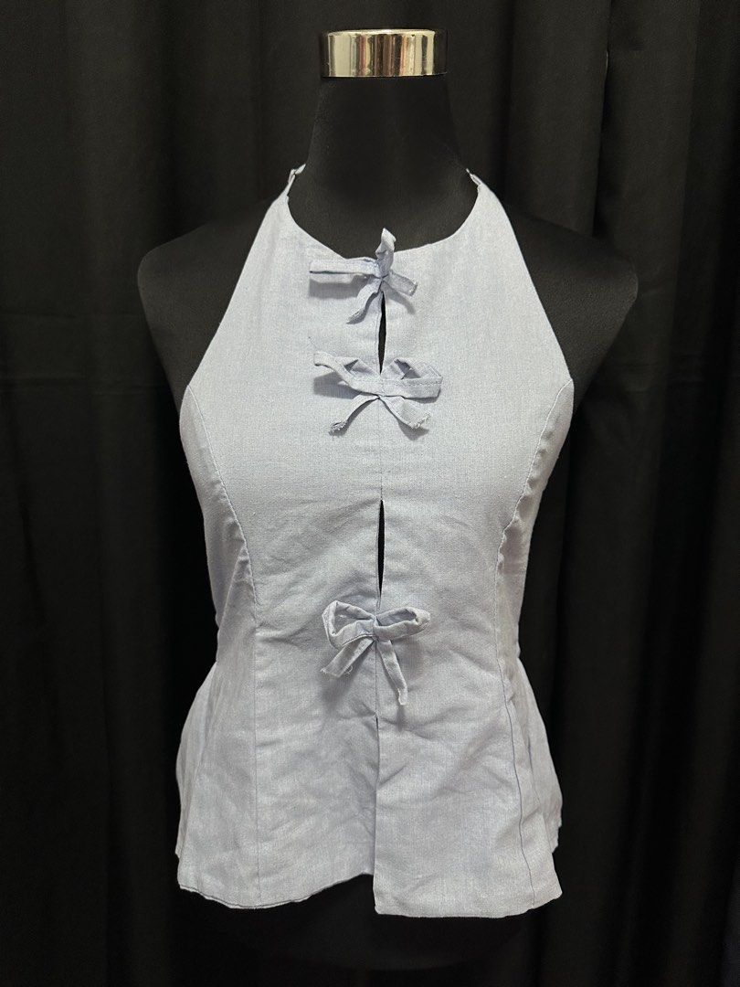 Blue Backless and Sleeveless Ribonned Top (Category: Sleeveless) located in Valenzuela. Submitted by chxnth (Listing ID 1446542311, Image 1). Description: > never worn > fits s-m > meet up within valenzuela/manila/caloocan only.