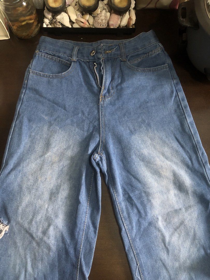 Blue Denim Wide Leg Jeans with Rips (Category: Jeans) located in Manila. Submitted by ninin03 (Listing ID 1446558071, Image 1). Description: - Blue denim wide leg jeans - Size Medium (approximate) - Features rips and frayed hems - Zipper fly - Perfect for a casual outfit.