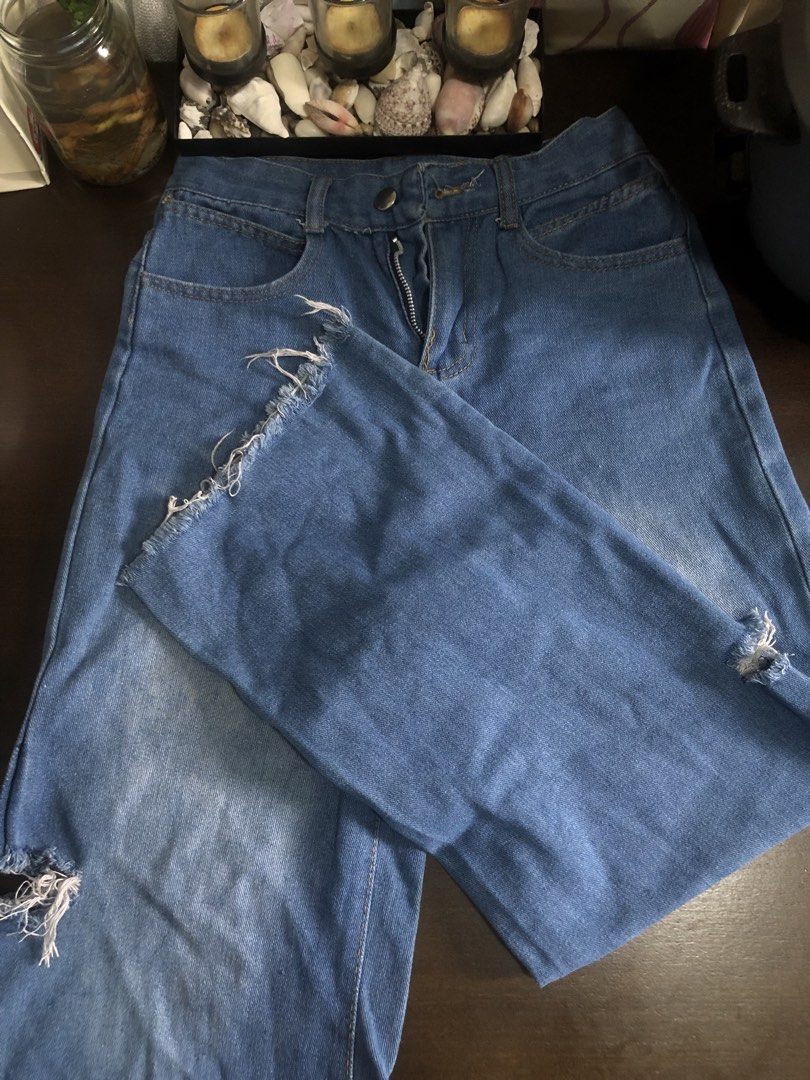 Blue Denim Wide Leg Jeans with Rips (Category: Jeans) located in Manila. Submitted by ninin03 (Listing ID 1446558071, Image 2). Description: - Blue denim wide leg jeans - Size Medium (approximate) - Features rips and frayed hems - Zipper fly - Perfect for a casual outfit.