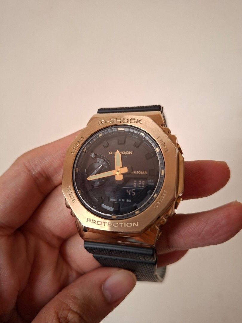 Casio G-Shock GA-2100G (Casioak) Gold Watch (Category: Men's Watches) located in Makati City. Submitted by rayluzuriaga (Listing ID 1446567792, Image 2). Description: Casio G-Shock (GA-2100G) Premium Metal Bezel Series - Gold Metal Bezel (44.4mm); Black Strap - Classic octagonal bezel (Casioak Style) - Digital and analog display - Already has a tempered glass protector installed. - Complete; Includes original box and tin container, manual, local 
