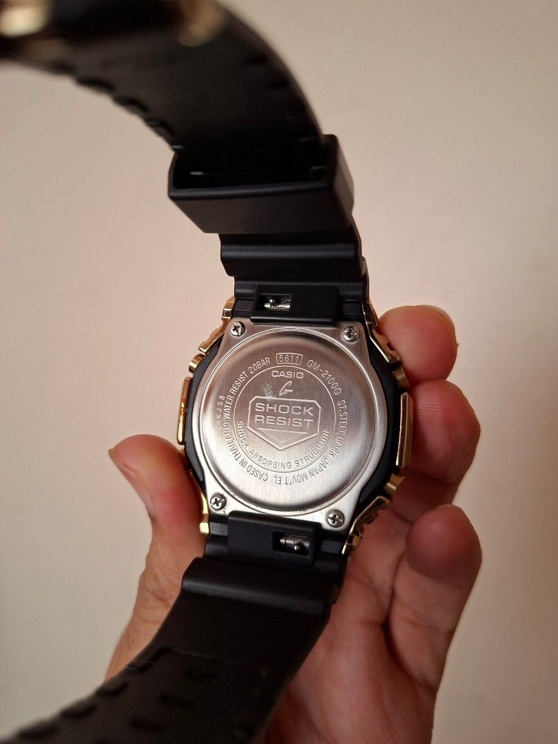 Casio G-Shock GA-2100G (Casioak) Gold Watch (Category: Men's Watches) located in Makati City. Submitted by rayluzuriaga (Listing ID 1446567792, Image 3). Description: Casio G-Shock (GA-2100G) Premium Metal Bezel Series - Gold Metal Bezel (44.4mm); Black Strap - Classic octagonal bezel (Casioak Style) - Digital and analog display - Already has a tempered glass protector installed. - Complete; Includes original box and tin container, manual, local 