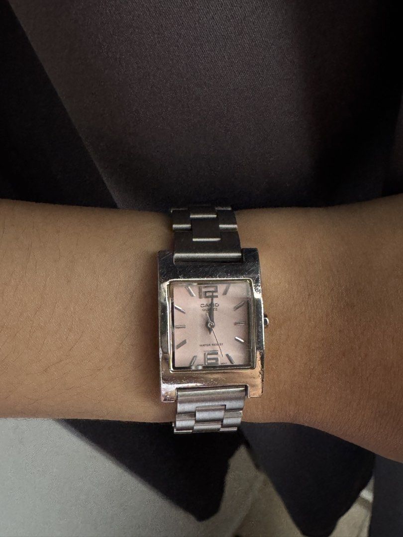 Casio Rectangular Watch - Pink Face (Category: Watches) located in Bangi. Submitted by brdyin (Listing ID 1446567765, Image 3). Description: -Functioning with new battery - Casio watch with a chic rectangular pink face. - Sleek silver metal strap for a stylish look. - Perfect for everyday use. - Clear and easy-to-read time display. - Comfortable fit on the wrist. - Comes presented in an attractive blue box..