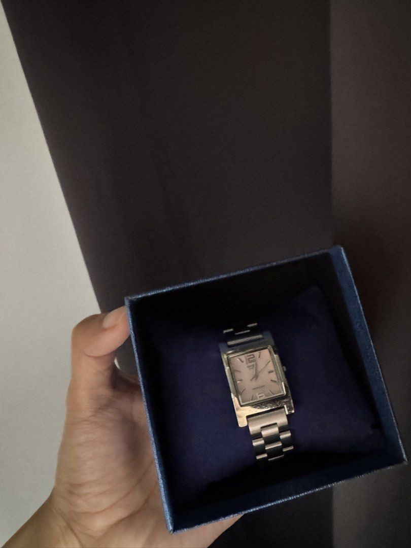 Casio Rectangular Watch - Pink Face (Category: Watches) located in Bangi. Submitted by brdyin (Listing ID 1446567765, Image 2). Description: -Functioning with new battery - Casio watch with a chic rectangular pink face. - Sleek silver metal strap for a stylish look. - Perfect for everyday use. - Clear and easy-to-read time display. - Comfortable fit on the wrist. - Comes presented in an attractive blue box..