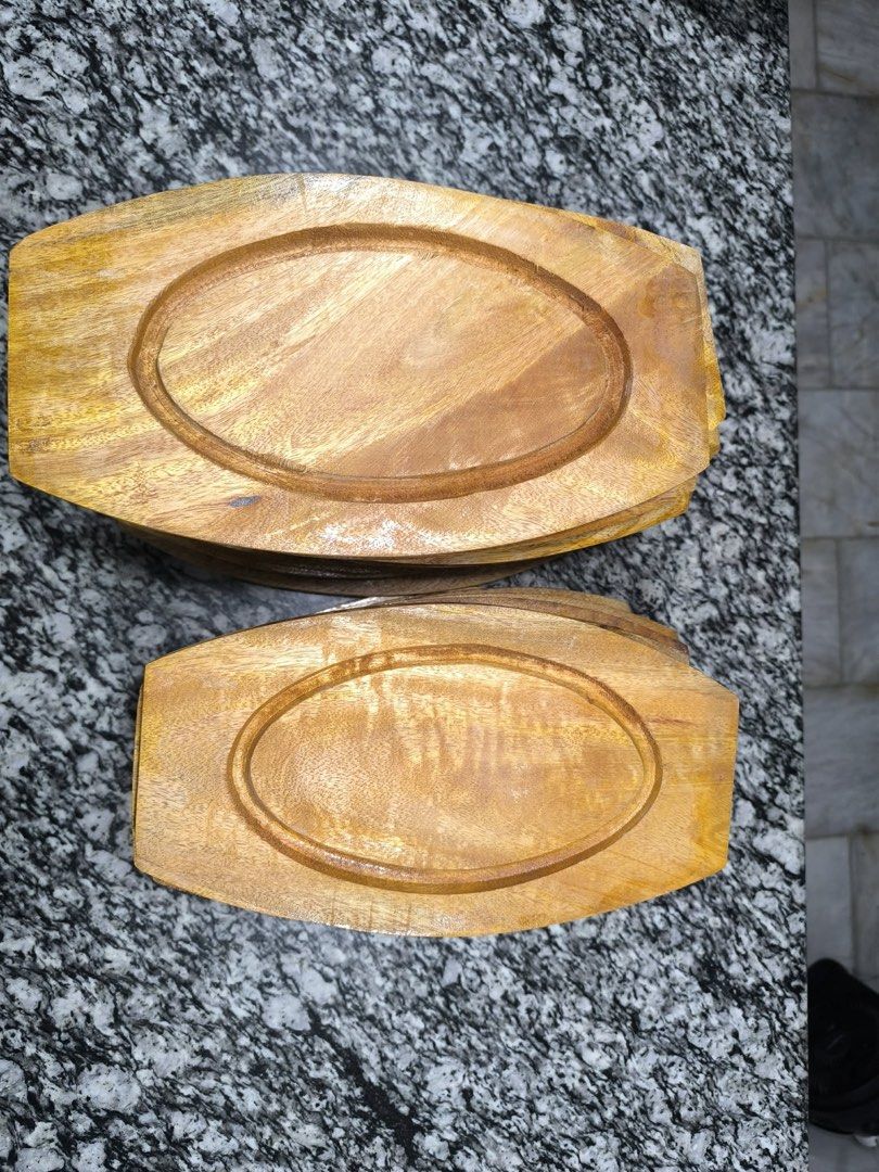 Cast Iron Sizzling Plates with Wooden Base (Category: Cookware & Accessories) located in Taguig. Submitted by treizie (Listing ID 1446575779, Image 3). Description: - Set of cast iron sizzling plates with wooden bases - Keeps food hot for longer - Protects surfaces with wooden base - Great for serving directly from oven/stovetop - Suitable for restaurant or home use - Multiple sets available.
