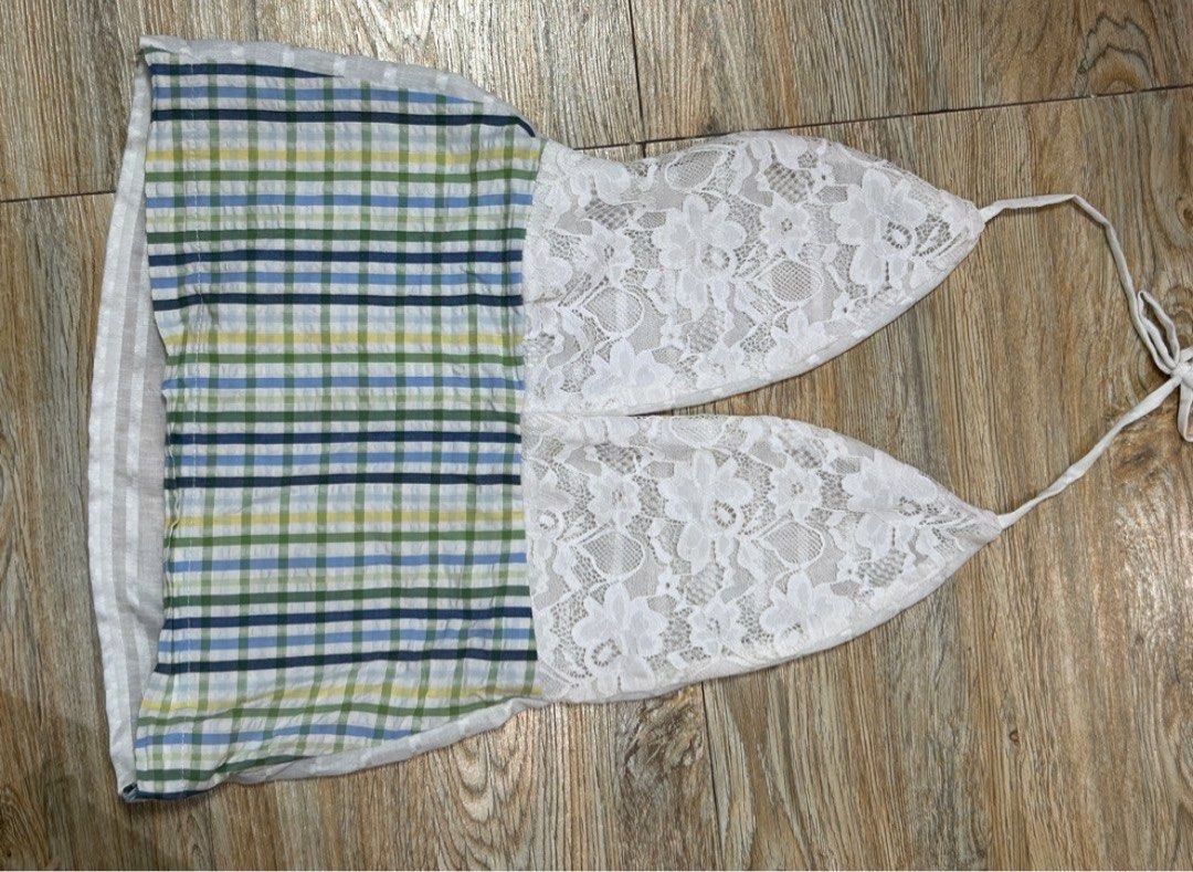 Checkered and Lace Halter Top (Category: Sleeveless) located in Las Pinas. Submitted by flocksvi (Listing ID 1446581022, Image 1). Description: - Bought at STP, reworked top, original proce was ₱750 - Cute halter top with a unique dual design. - Features a checkered pattern on one side and white lace on the other. - Ties at the neck for an adjustable fit. - Ideal for beach days or casual outings. - Pairs well with shorts or skirts..
