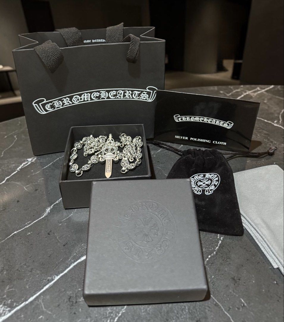 Chrome Hearts Dagger Pendant Necklace Silver (Category: Luxury Accessories) located in Angeles City. Submitted by curationn1 (Listing ID 1446580357, Image 1). Description: -Chrome Hearts dagger pendant necklace - Silver chain adorned with dagger charm - Comes with packaging: box, dust bag, and polishing cloth - A stylish and essential accessory.