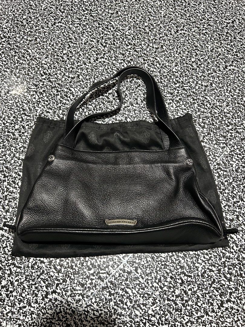 Chrome Hearts jj dean bag (Category: Luxury Bags & Wallets) located in Manila. Submitted by heritage_thrift (Listing ID 1446632494, Image 2). Description: - Genuine Chrome Hearts black leather tote bag - Multiple zippered pockets for organization - Stylish buckle detail on the front - Subtle Chrome Hearts logo plate on the back - Comes with original dust bag - Ideal for everyday carry and versatile use.