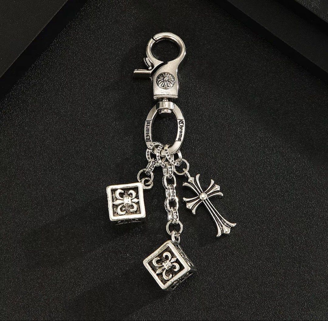 Chrome Hearts Silver Cross Dice Keychain (Category: Luxury Accessories) located in Angeles City. Submitted by curationn1 (Listing ID 1446578793, Image 3). Description: - Chrome Hearts keychain - Features iconic cross and dice charms - Comes with original packaging, dust bag, and polishing cloth - Perfect accessory for your collection - Approximately 10.7cm in length.
