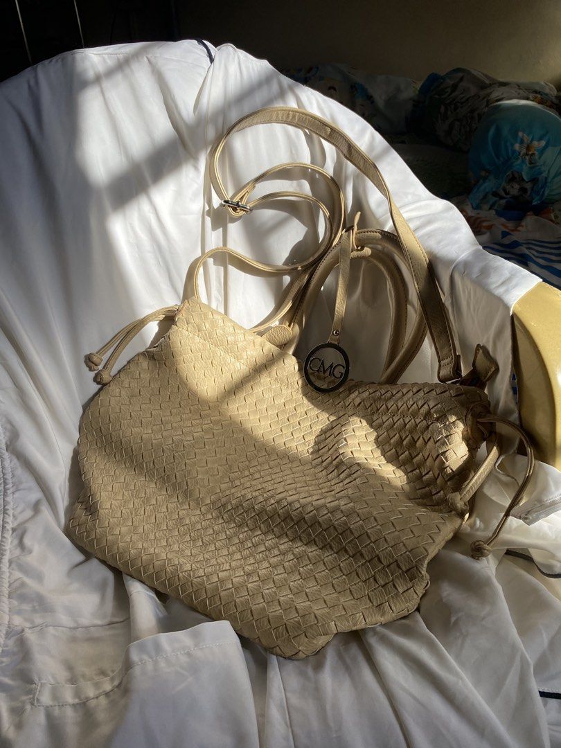 CMG Beige Woven Shoulder/Tote Bag (Category: Tote Bags) located in Quezon City. Submitted by declutter.repsaj (Listing ID 1446654150, Image 3). Description: - brand new, never used -rfs: decluttering - Includes two straps: one short, one long adjustable crossbody strap - CMG logo on a metal tag - Ideal for everyday use.