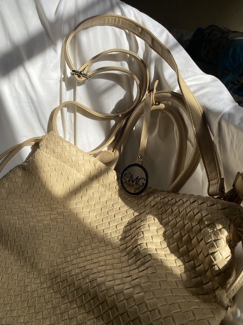 CMG Beige Woven Shoulder/Tote Bag (Category: Tote Bags) located in Quezon City. Submitted by declutter.repsaj (Listing ID 1446654150, Image 2). Description: - brand new, never used -rfs: decluttering - Includes two straps: one short, one long adjustable crossbody strap - CMG logo on a metal tag - Ideal for everyday use.