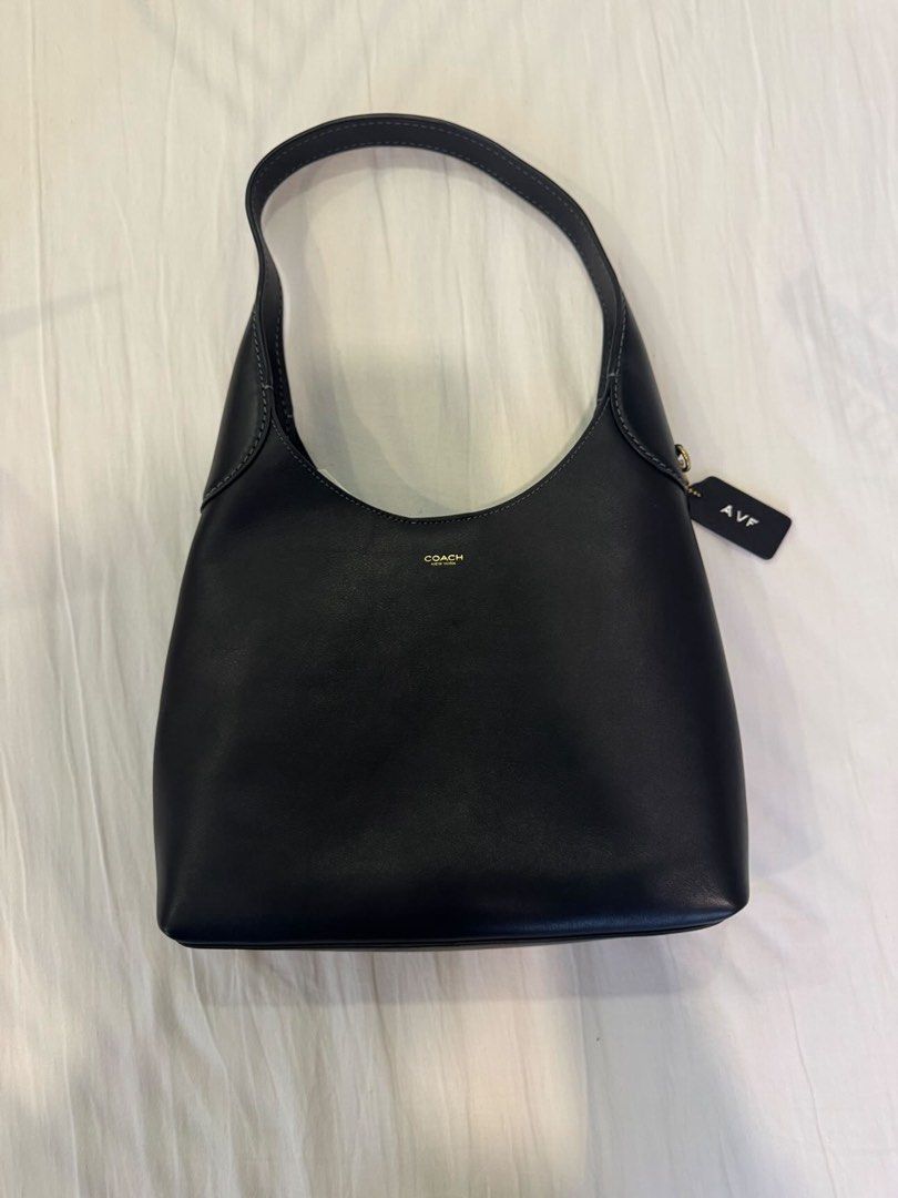 Coach Brooklyn 28 Shoulder Bag (Category: Luxury Bags & Wallets) located in Mandaluyong City. Submitted by marceditems (Listing ID 1446626439, Image 3). Description: - Authentic black leather Coach brooklyn hobo bag - Comes with original dust bag and shopping bag - Features a small tag with initials 'AVF' - Good as new, only used once.