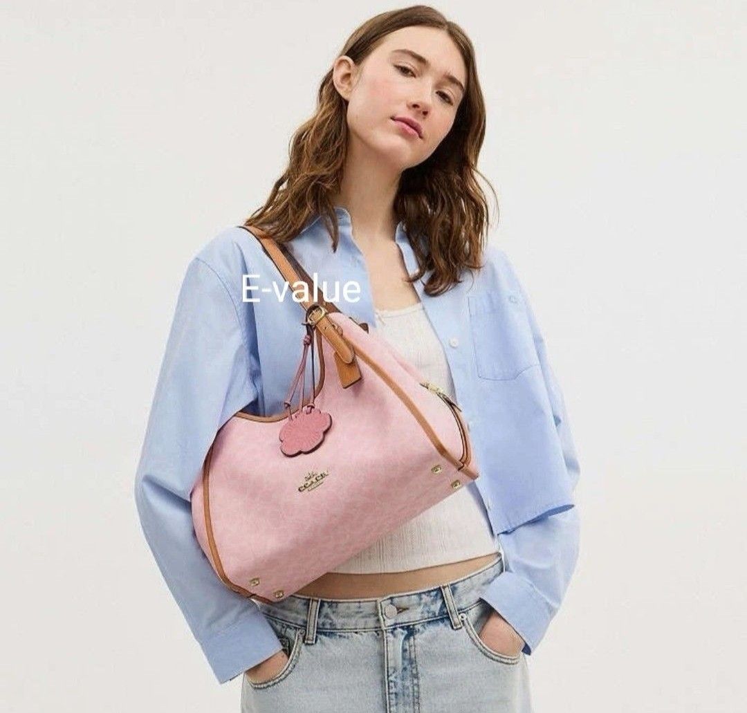 Coach Original Signature Powder Pink With Flora Charm Limited Edition Erin Shoulder Bag For Women Come With Complete Set Suitable For Gift (Category: Shoulder Bags) located in Kuala Lumpur. Submitted by evalue_tech_enterprise (Listing ID 1446699922, Image 2). Description: ✅Measurements Length: 12.25" Height: 10.25" Width: 5.5" Materials Signature coated canvas, smooth leather and vachetta leather Recycled polyester lining Handle Adjustable handle