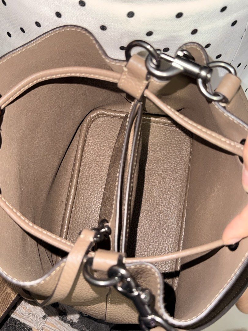 Coach Rowan Bucket Bag (Darkstone) (Category: Luxury Bags & Wallets) located in Manila. Submitted by angel.camille (Listing ID 1446617121, Image 3). Description: Coach Rowan Bucket Bag (Darkstone) • Size: 21.5 x 21.5 x 14cm • Condition: Used once • Inclusion: Paper bag • Issue: No box, andito po ang tag ang nawawala lang yung mismong sabitin • Original Price: ₱17k via US Pasabuy - Ideal everyday bag.
