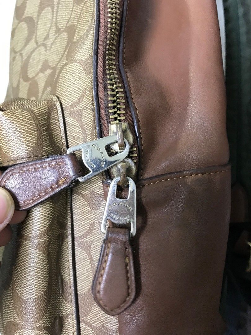 COACH SMALL BACKPACK (Category: Luxury Bags & Wallets) located in Naga. Submitted by black-market00 (Listing ID 1446714173, Image 3). Description: GANDA PA RIN NETO KAHIT MAY ISSUE RANK AB AUTHENTIC ISSUE IS MAY STAIN SYA SA LIKOD YUNG GREEN NA PART IDK IF MATATANGGAL SYA KUNG LALABHAN AND MAY MAY MALIIT NA SULAT NANG PEN AT YUNG ZIPPER WORKING PA NAMAN PERO YUNG ISA HINDI NA.