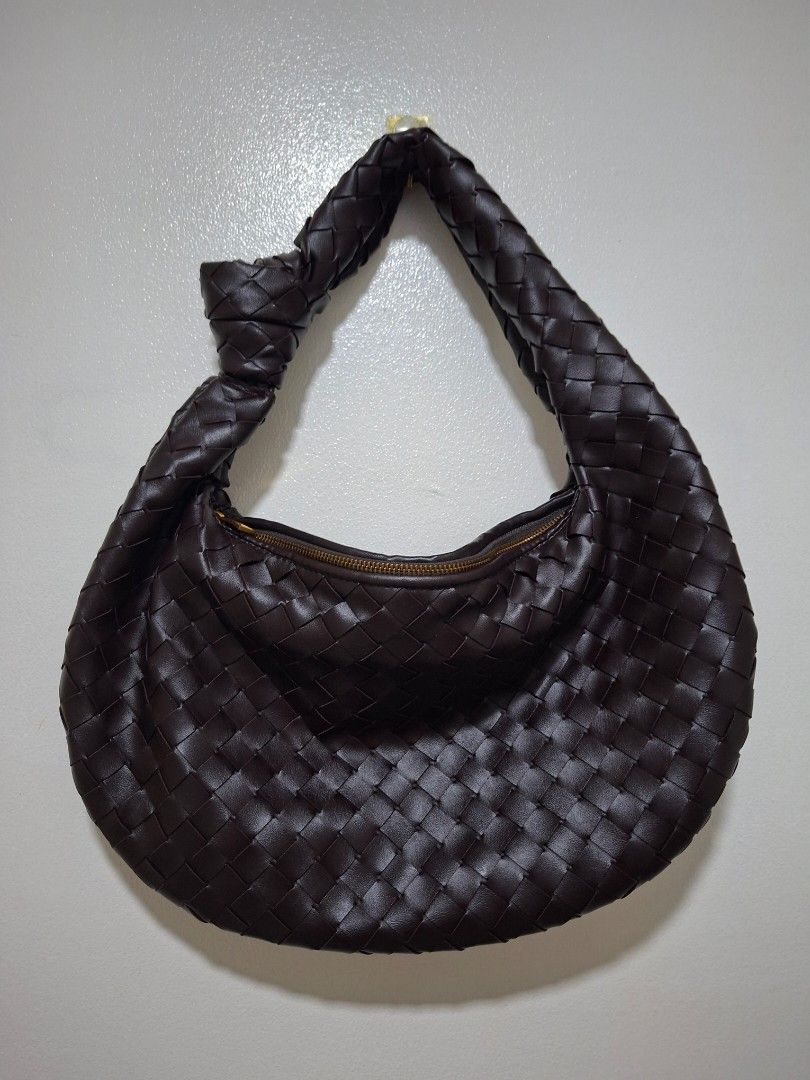 Dark Brown Woven Leather Hobo Bag (Category: Shoulder Bags) located in Cabanatuan. Submitted by riworks (Listing ID 1446635696, Image 2). Description: - Dark brown woven leather hobo bag - Unique knotted strap design - Secure zipper closure - Spacious interior, great for everyday essentials - Check photos for detailed condition.