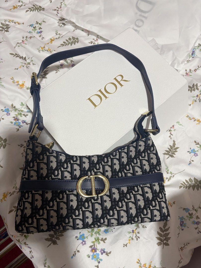 Dior Monogram Shoulder Bag (Category: Luxury Bags & Wallets) located in Manila. Submitted by beng.2625 (Listing ID 1446700187, Image 1). Description: - Classic Dior shoulder bag - Iconic monogram pattern - Navy blue accents - Gold CD hardware - Comes with original Dior box - Stylish and versatile for everyday use.