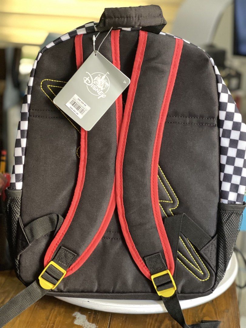 Disney Pixar Cars Lightning McQueen Backpack (Category: Babies & Kids Fashion) located in Makati City. Submitted by esila.essentials (Listing ID 1446627773, Image 2). Description: - Cool Lightning McQueen backpack for kids - Features checkered flag design and lots of Cars graphics - Main compartment and front pocket for storage - Side mesh pockets for water bottles - Padded straps for comfortable wear - Perfect for school or travel adventures - O