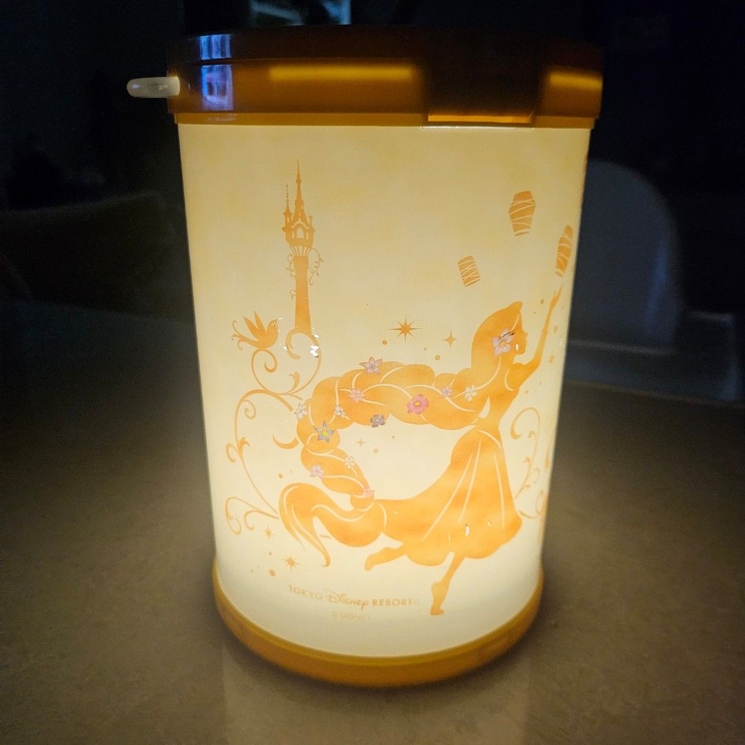 Disney Tangled popcorn bucket (Category: Lighting) located in Manila. Submitted by mystar0411 (Listing ID 1446648177, Image 2). Description: - Disney Tangled themed lantern lamp - Features Rapunzel and iconic floating lanterns - Orange and yellow color scheme - Inspired by Tokyo Disney Resort - Ideal gift for Disney fans or room decor.