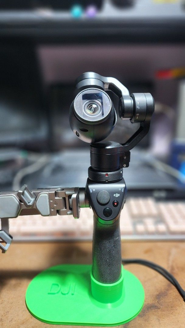 DJI Osmo Handheld Gimbal Stabilizer with Accessories (Category: Gimbals & Stabilizers ) located in Caloocan City. Submitted by julsbaldo (Listing ID 1446673562, Image 1). Description: - DJI Osmo handheld gimbal stabilizer - Includes: Gimbal, handle, camera lens cap, charging dock, 2 batteries, carrying case - Bonus: Green DJI stand included - Achieve smooth, professional-looking video footage - Ready for your next creative project.