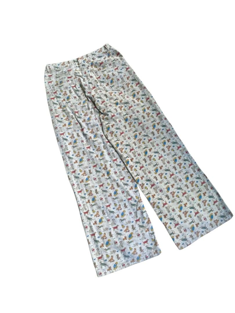 Dog Print Wide Leg Pants (Category: Jeans) located in Manila. Submitted by ronmark (Listing ID 1446673916, Image 2). Description: Pants with a all-over dog print. Light-colored base with various dog breeds scattered throughout. Wide leg style..