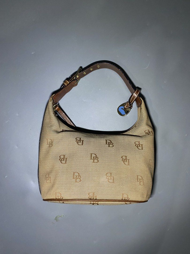 Dooney & Bourke (NEGOTIABLE AND AUTHENTIC (Category: Luxury Bags & Wallets) located in San Jose del Monte. Submitted by kidfromnclb (Listing ID 1446642855, Image 2). Description: - Classic Dooney & Bourke hobo bag - Tan canvas with all-over DB monogram print - Brown leather trim and strap - Interior features a vibrant pink lining - Secure zipper closure - Ideal everyday bag - no issue - all zippers working - Authentic.