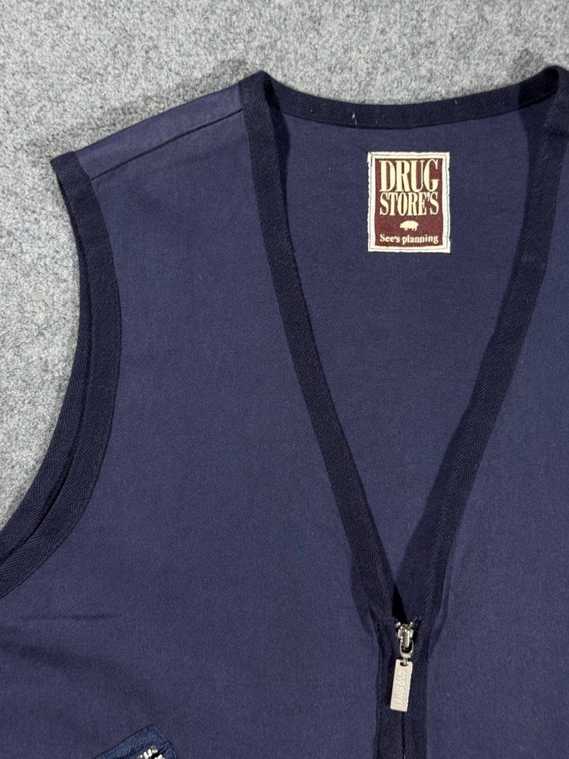 Drug store's Zip-Up Utility Vest (Category: Vests) located in Zamboanga. Submitted by zhifay (Listing ID 1446712142, Image 3). Description: Drug store's Zip-Up Utility Vest Color: Dark Navy Blue Size: Large Measurements: Pit to Pit: 23inches Length: 25.5inches Excellent Condition Features asymmetrical zip cargo pockets, rear zippered game pocket, and herringbone edge binding. Authentic Y2K Japanese brand piece. Price: ₱599.