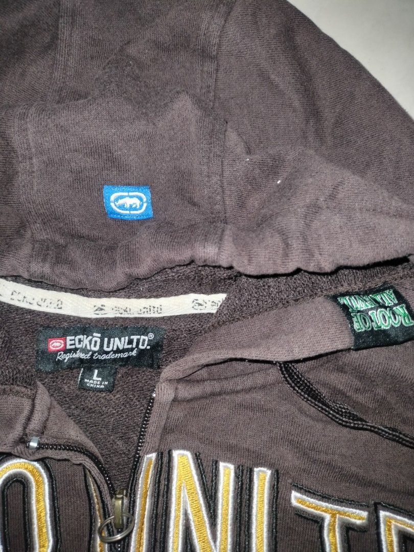 Ecko Unltd. Brown Zip-Up Hoodie (Category: Activewear) located in Jolo. Submitted by zah-zah (Listing ID 1446708252, Image 2). Description: - Brand: Ecko Unltd. - Color: Brown - Type: Zip-up Hoodie - Size: Large (L) - Features: Classic Ecko rhino logo on the front - Style: Great for casual wear - Condition: Check tag details for more information.