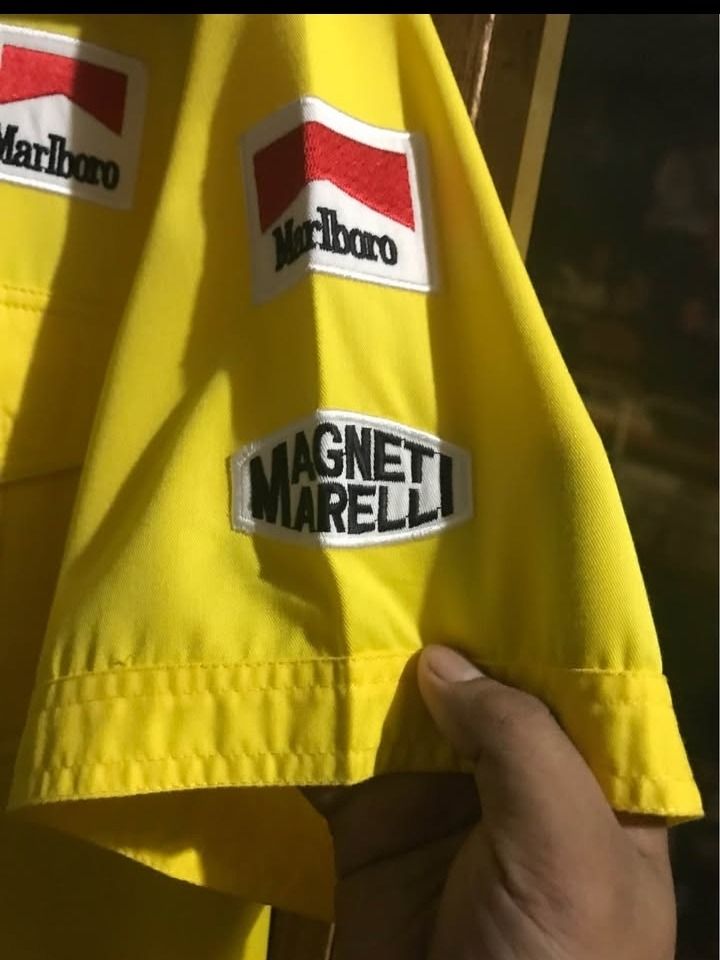 Ferrari F1 Crew Shirt (Category: Activewear) located in Caloocan City. Submitted by shinroo (Listing ID 1446579731, Image 3). Description: Official Tommy x Ferrari Collab late 90s Schumacher era. Patches: Shell, Marlboro, Ferrari, FedEx, Magneti Marelli - ALL EMBROIDERED BACKHIT: Big F1 car embroidery with sponsors.