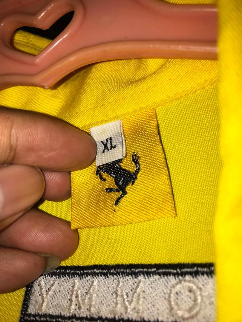 Ferrari F1 Crew Shirt (Category: Activewear) located in Caloocan City. Submitted by shinroo (Listing ID 1446579731, Image 2). Description: Official Tommy x Ferrari Collab late 90s Schumacher era. Patches: Shell, Marlboro, Ferrari, FedEx, Magneti Marelli - ALL EMBROIDERED BACKHIT: Big F1 car embroidery with sponsors.